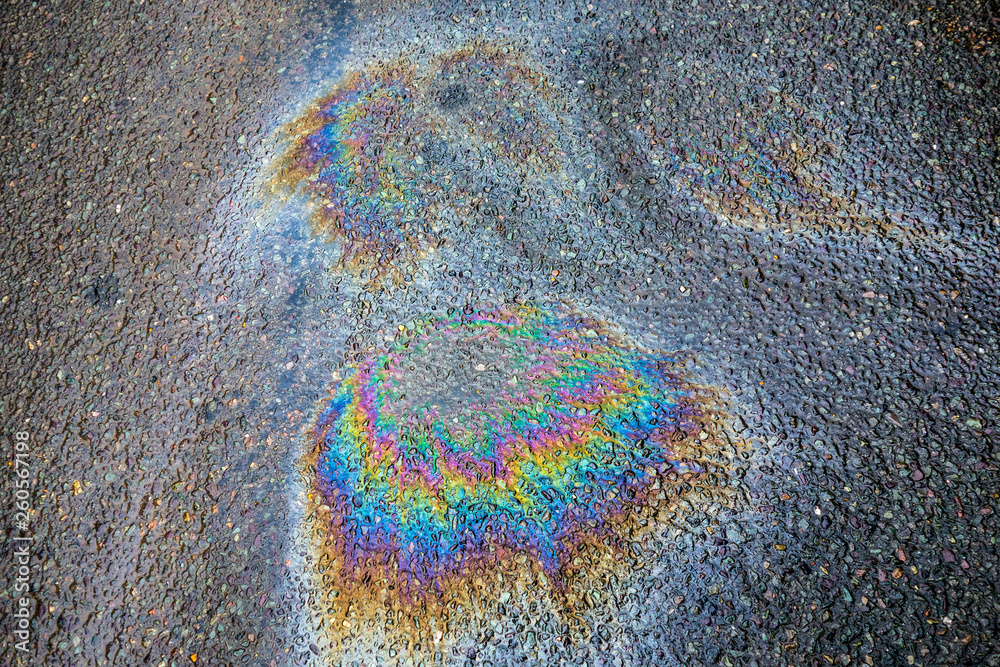 Obraz premium Oil Petrol Pollution Rainbow Spill on A Road