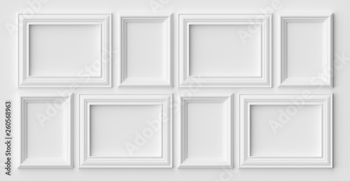 White photo or picture frames on the white wall with shadows