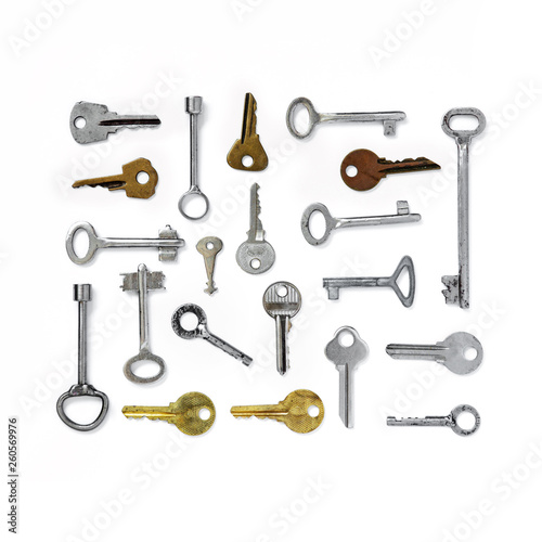 The figure is a rectangle of old keys on white isolated background. Old keys.