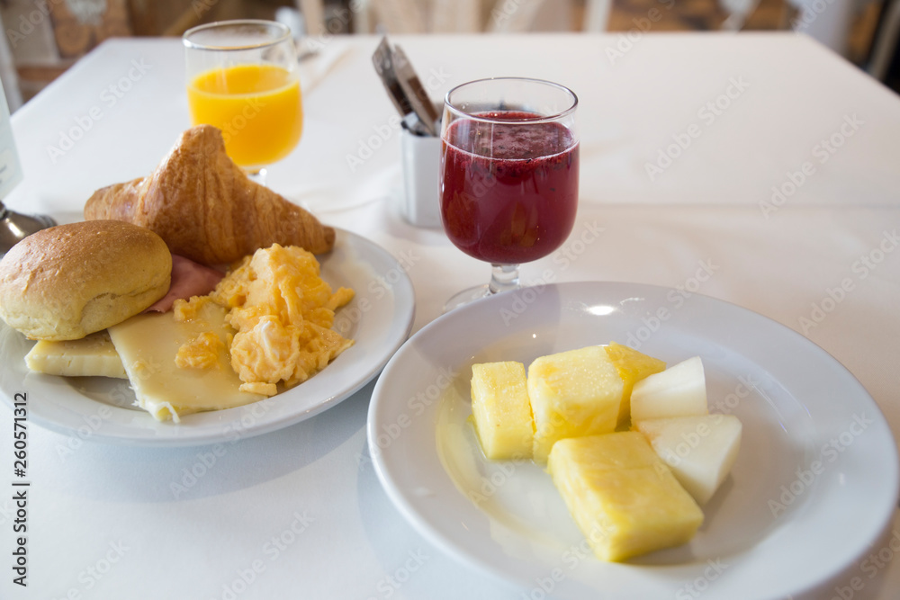 Breakfast with orange juice fruit and omelette with croissants Breakfast with orange juice fruit and omelette with croissants