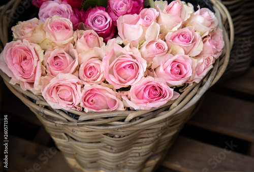 Basket of lightpink roses in the flower shop for sale.