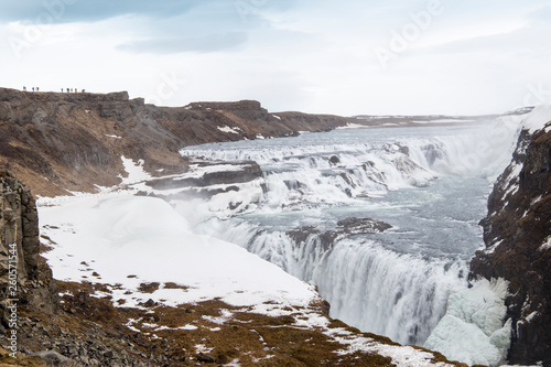 Amazing Icelandic winter landscape of majestic waterfall of frozen Gullfoss