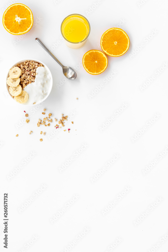 food for healthy breakfast with granola and fresh orange juice on bright white background top view mock up food for healthy breakfast with granola and fresh orange juice on bright white background top view mock up