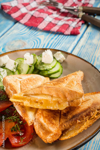 Sandwiches with cheese  tomatoes and cucumber.