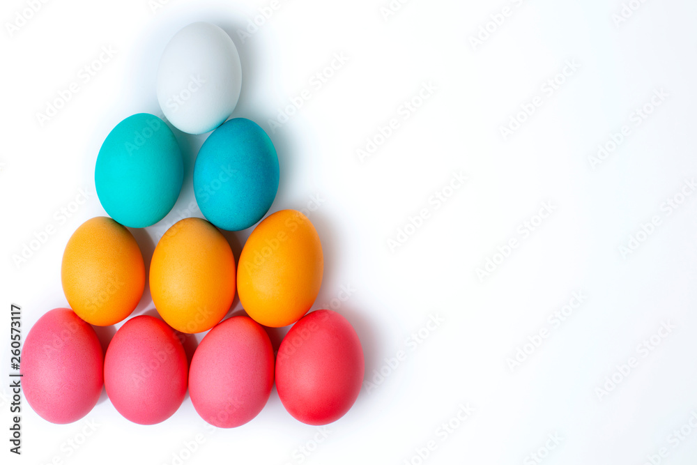 colorful Easter pyramid of chicken eggs on a white background. Happy Easter. Easter set. isolated in white