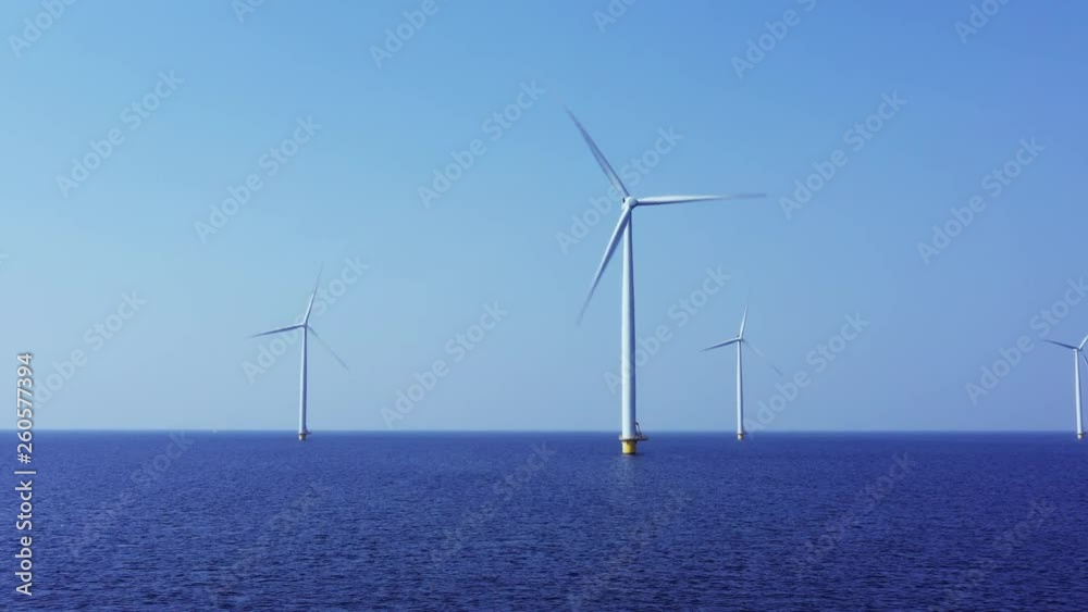 WindTurbines in a blue sea on a sunny day WindTurbines in a blue sea on a sunny day