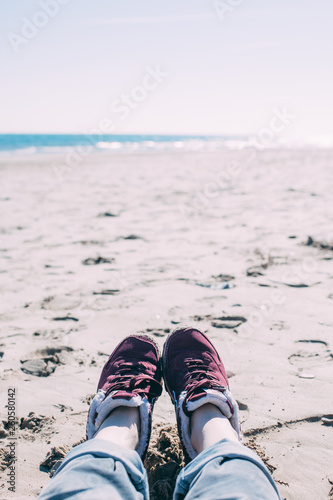 Girl relaxing on sand beach