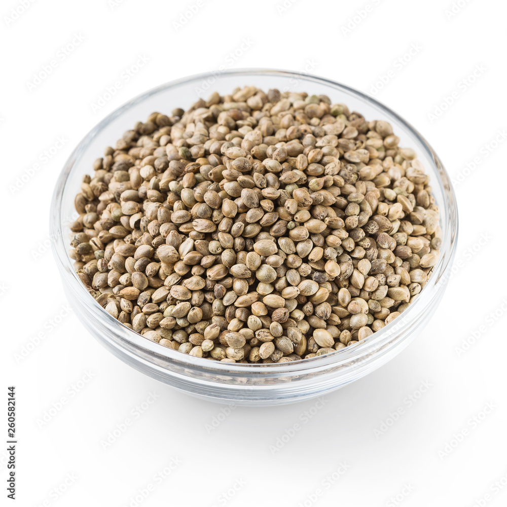 Bowl of hemp seeds isolated on white