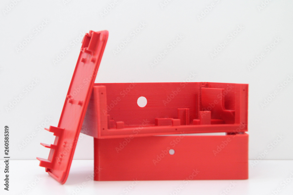 3d printing red plastic case isolated on white background, produced from pla, horizontal view, macro - obrazy, fototapety, plakaty 