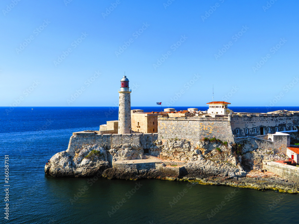 Havana, Cuba light house of La Cabana Fort and Morro Castle on a clear day with a view from the water.
