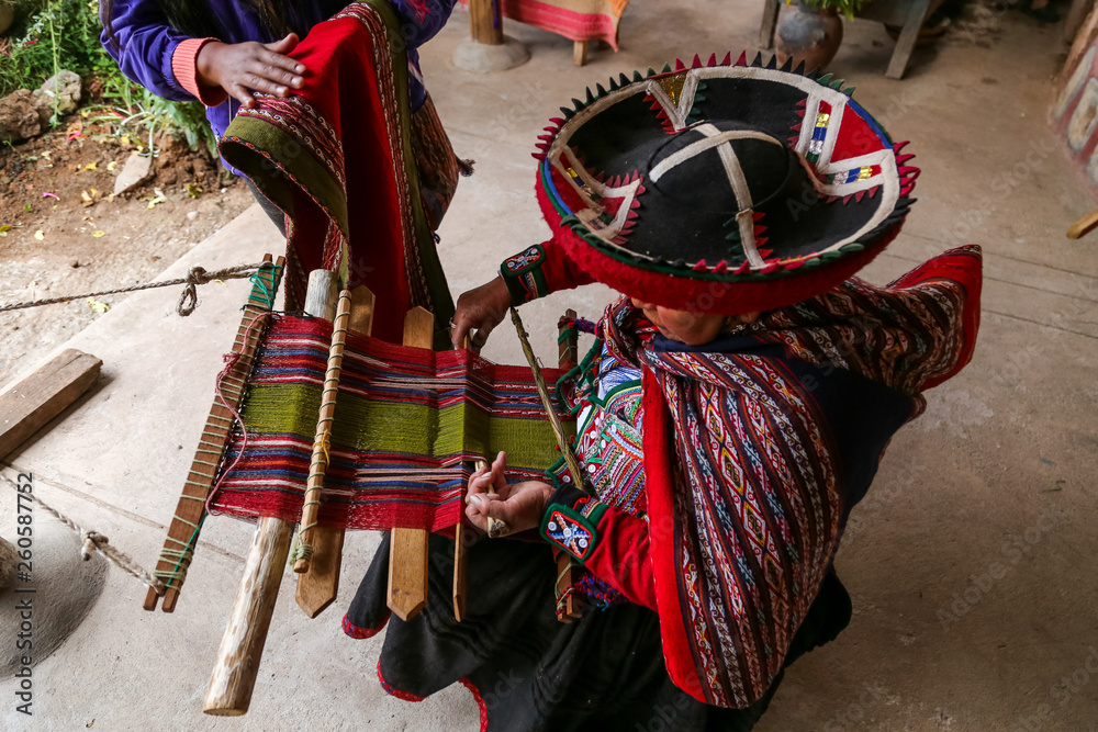 Weaving woman, hand-made colorful materials.