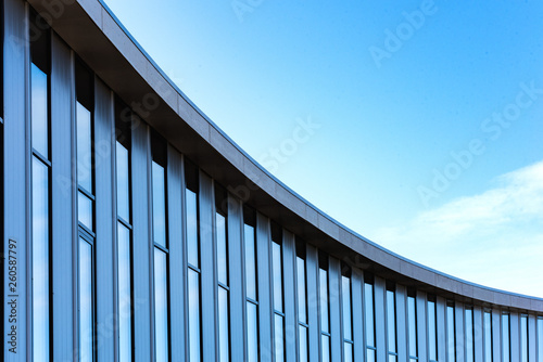 A large glass building with a curved