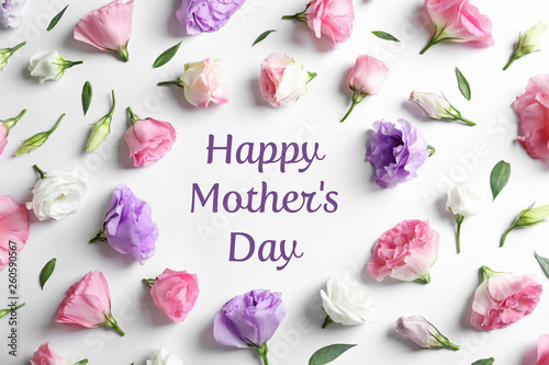 Flat lay composition with beautiful Eustoma flowers on light background