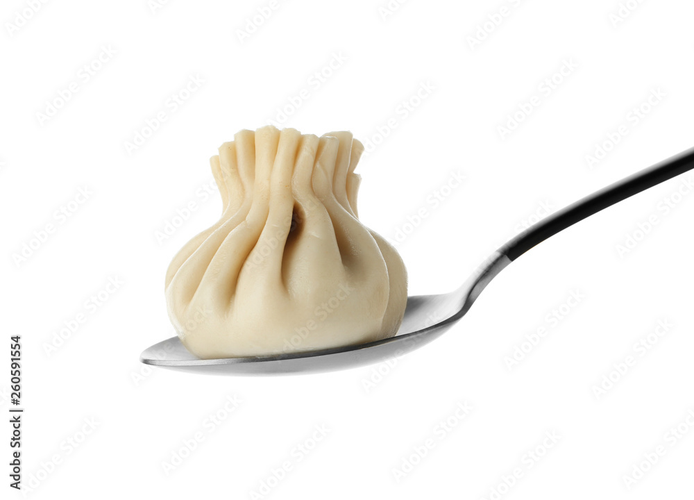 Spoon with tasty dumpling isolated on white Spoon with tasty dumpling isolated on white