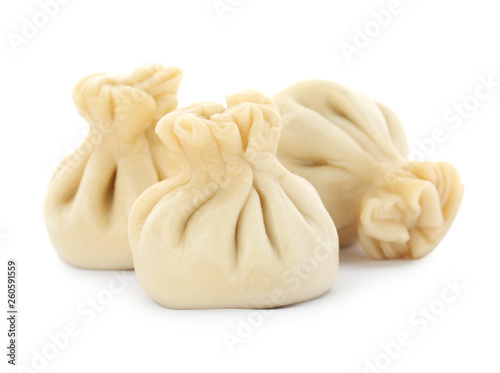 Boiled dumplings with tasty filling on white background