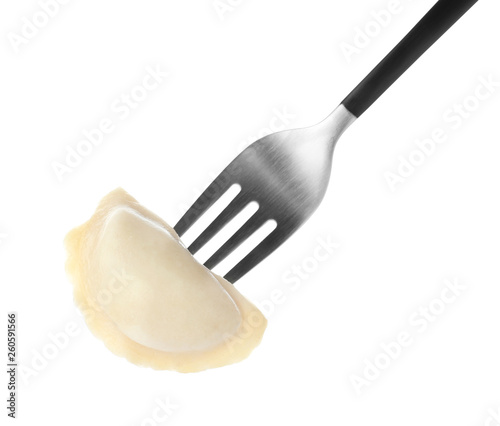 Fork with tasty dumpling isolated on white photo