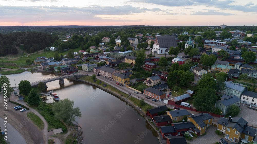 Beautiful aerial city landscape with idyllic river and old buildings at summer evening in Porvoo, Finland.