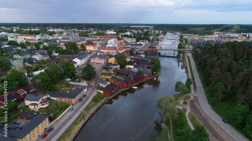 Beautiful city landscape with idyllic river and old buildings at summer evening in Porvoo, Finland.