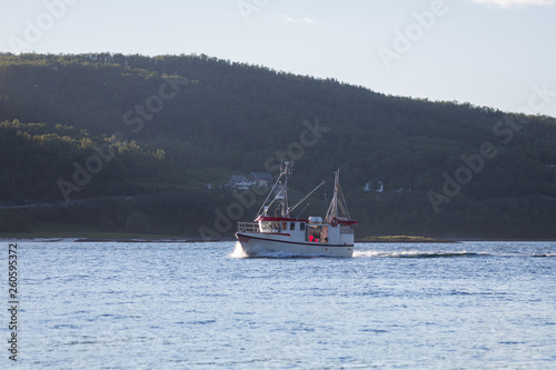fishing boat on the ocean. Fjord in Norway.