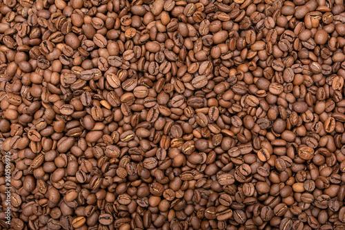 Roasted coffee beans background. Top view. Copy space for text.