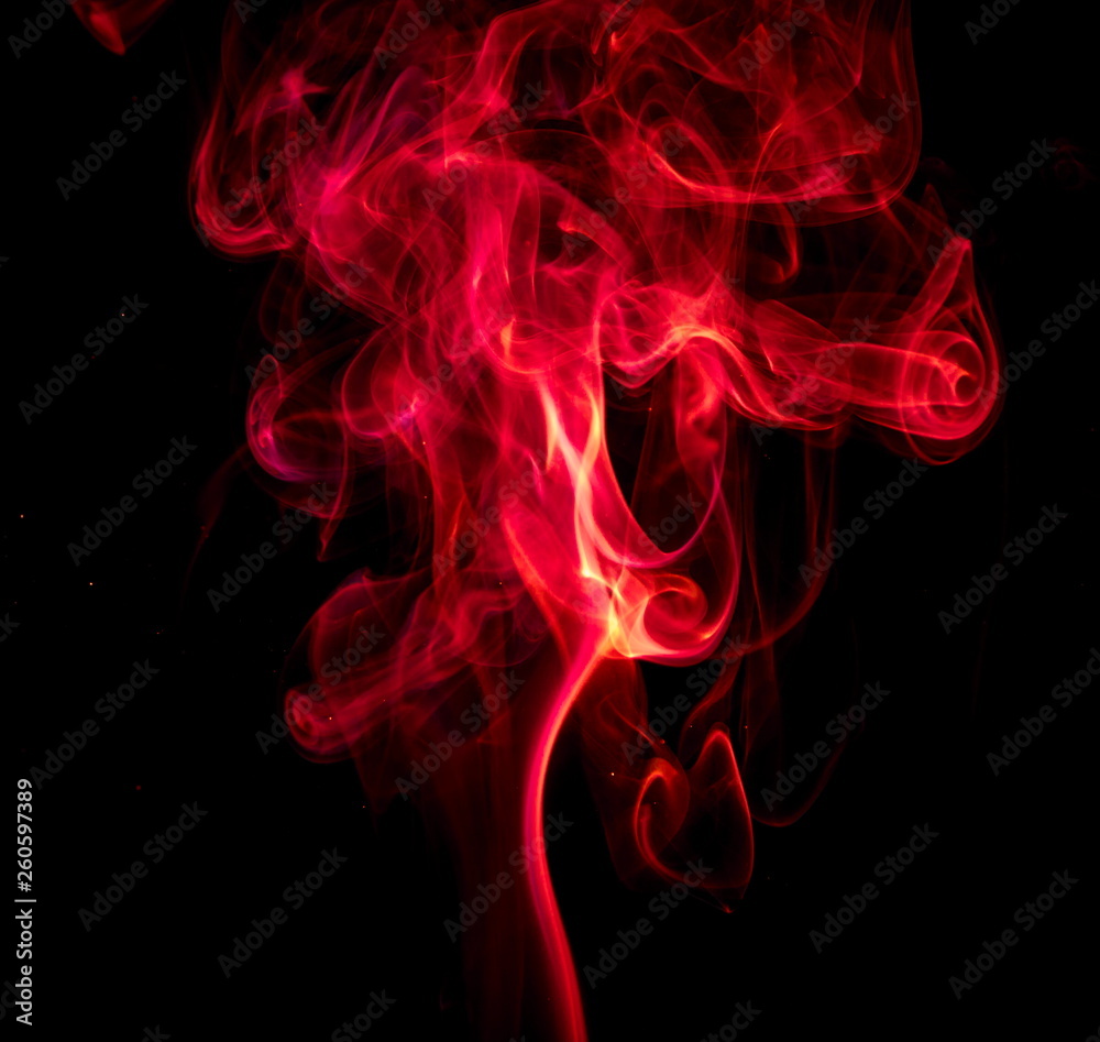 Fototapeta premium Red smoke on black background