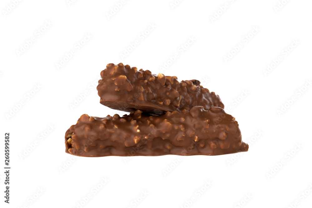 Chocolate bar on a white background. Candy with peanuts and raisins, caramel, puffed rice waffles, in chocolate isolated on white background. Chocolate bar on a white background. Candy with peanuts and raisins, caramel, puffed rice waffles, in chocolate isolated on white background.