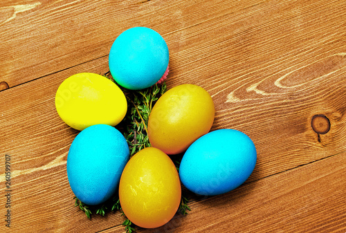 Wallpaper Mural colorful easter eggs on wooden background Torontodigital.ca