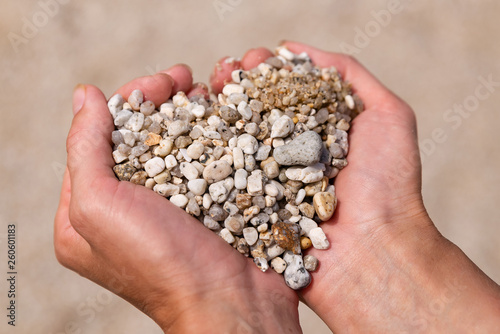 Heart symbol in feminine hand