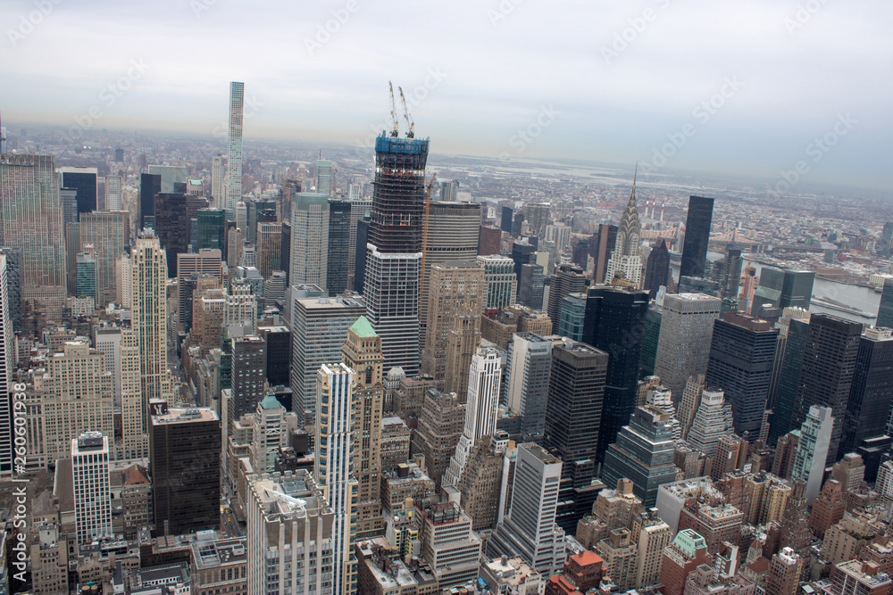 Fototapeta premium Aerial view of Manhattan in New York City showing the classic high rise buildings and city scape in the USA