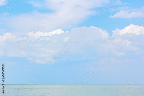 Serene seascape with white clouds above the sea