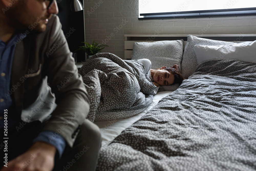 Man is going to work in the morning leaving a woman in the bed. The Impact Of Long Hours On Our Relationships. Man is going to work in the morning leaving a woman in the bed. The Impact Of Long Hours On Our Relationships.