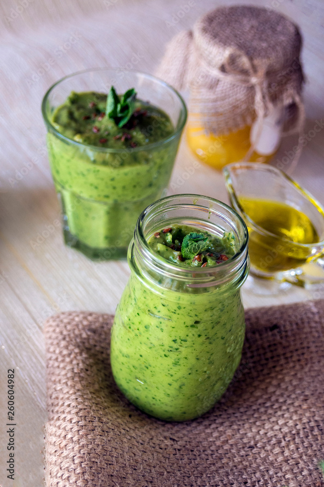 Thick nutritious smoothies, which include: avocado, apple, banana, spinach, orange juice, honey, flax seeds, mint and olive oil. Proper nutrition. Healthy lifestyle. Thick nutritious smoothies, which include: avocado, apple, banana, spinach, orange juice, honey, flax seeds, mint and olive oil. Proper nutrition. Healthy lifestyle.
