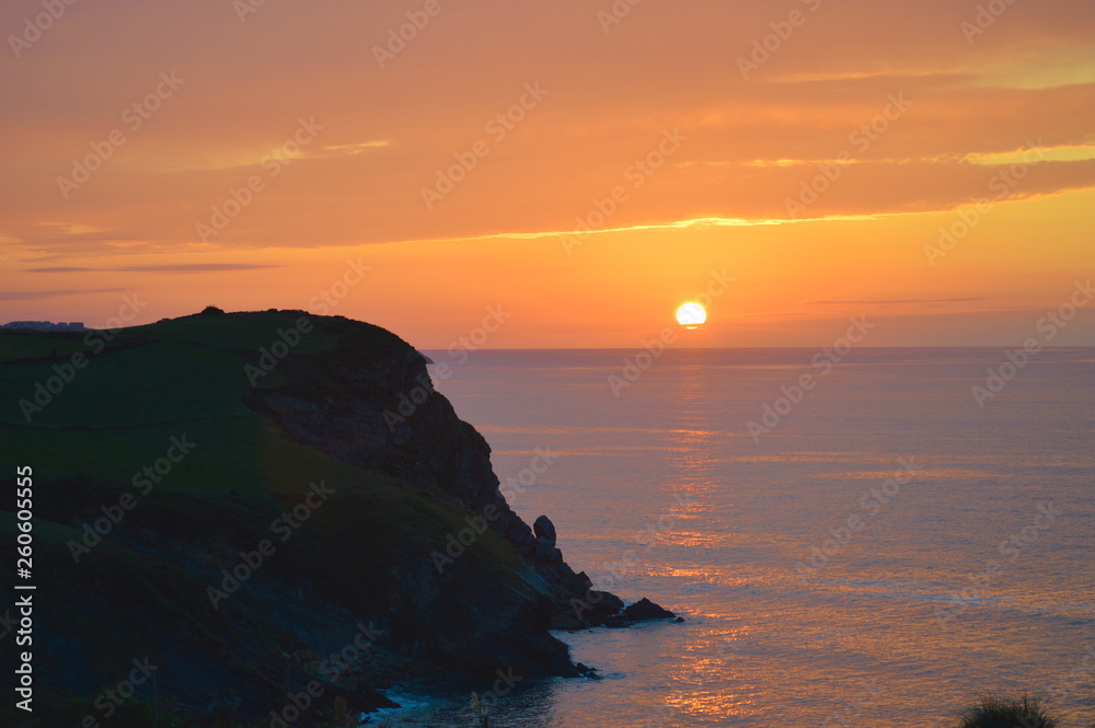 Orange sun in a sunset at the cantabrian coast, Ruiloba, Cantabria
