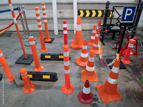 Fotografie lot of parking traffic cones and limiting driving speed barriers at hardware sto