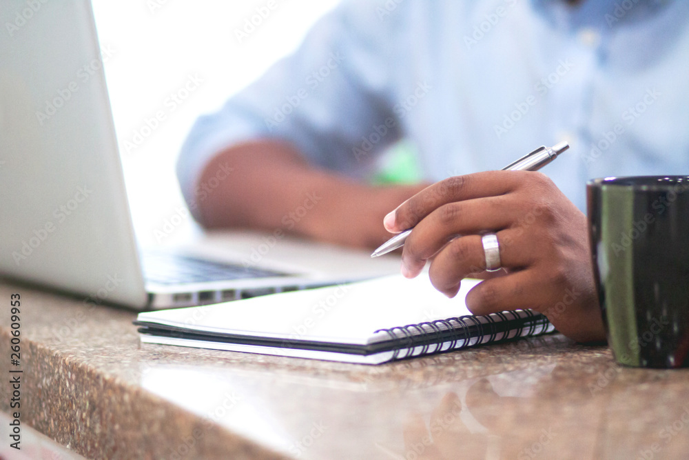 Midsection of businessman working in office Midsection of businessman working in office