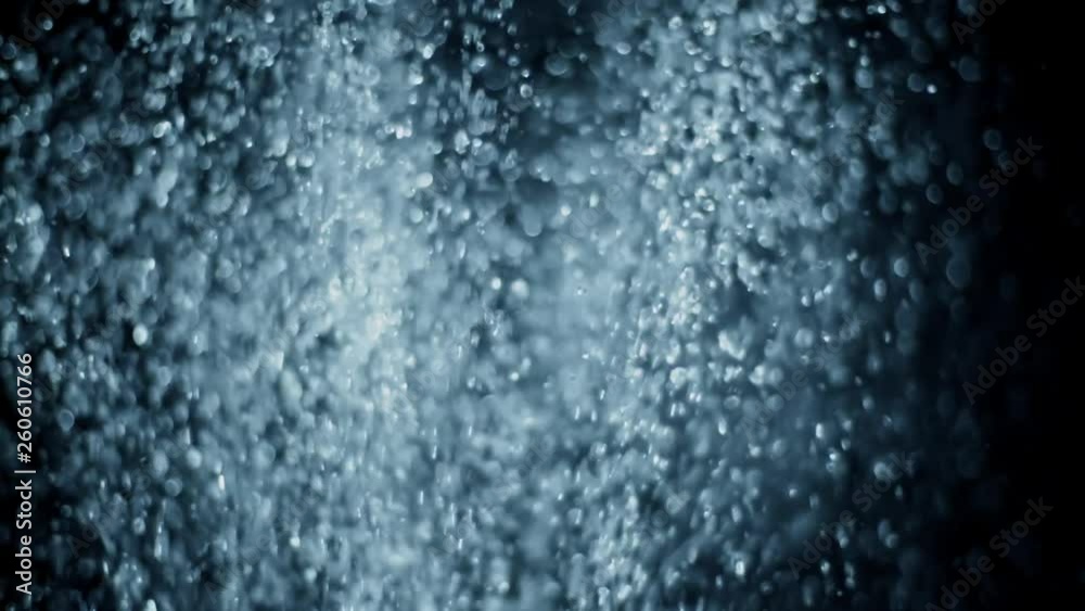 Fountain, fresh blue water splash in slow motion, bouncing clean liquid drops and falling down on black background, rain droplets, abstract Fountain, fresh blue water splash in slow motion, bouncing clean liquid drops and falling down on black background, rain droplets, abstract