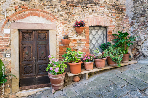 Detail of stone houses in an alley of an ancient Tuscan village.