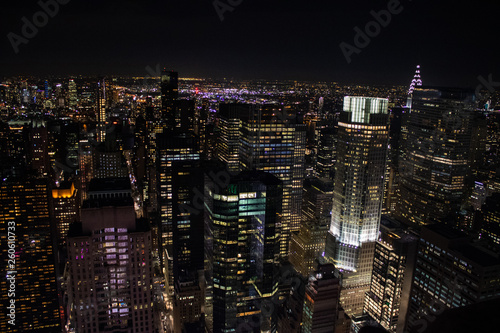 Night time aerial view of Manhattan in New York City showing the classic high rise buildings and city scape in the USA © Duncan