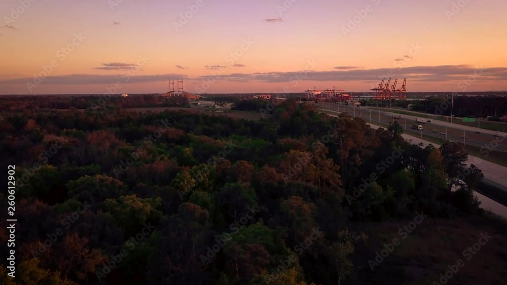 Aerial shot of drone flying towards the Dames Point Bridge in Jacksonville at the sunset Aerial shot of drone flying towards the Dames Point Bridge in Jacksonville at the sunset