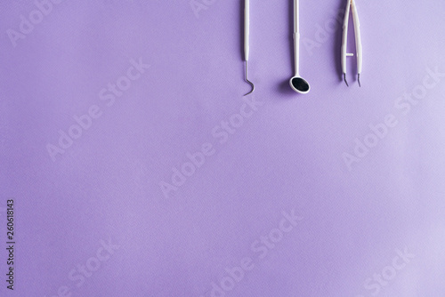 Dental instruments on colorful background with copy space