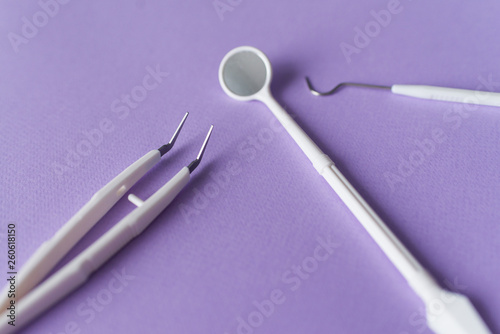 Dental instruments on colorful background photo