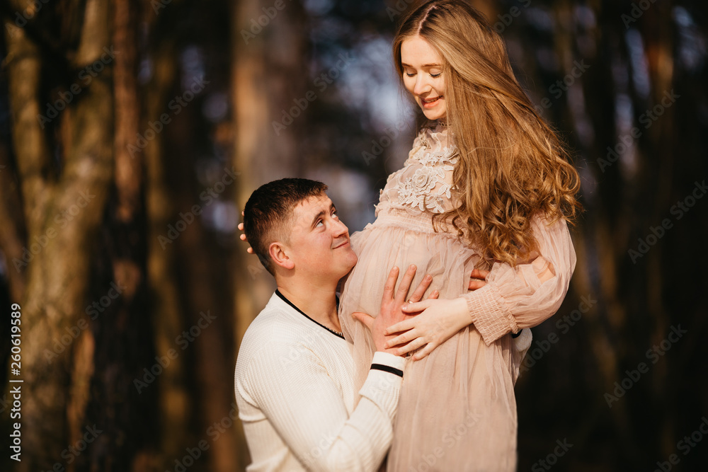 Beautiful portrait of a pregnant woman and her husband.