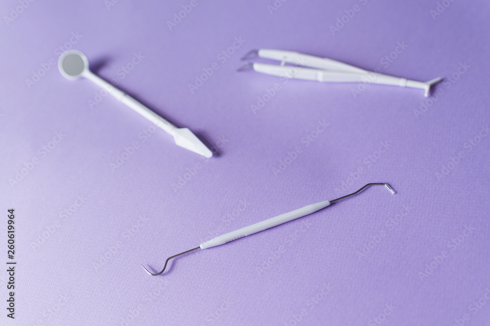 Dental instruments on colorful background