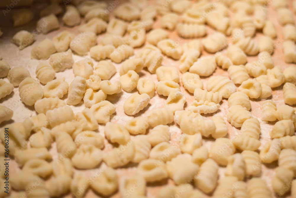 Pasta raw closeup background. Delicious dry uncooked ingredient for traditional Italian cuisine dish. Textured variety shapes. Top view. Copy space Pasta raw closeup background. Delicious dry uncooked ingredient for traditional Italian cuisine dish. Textured variety shapes. Top view. Copy space