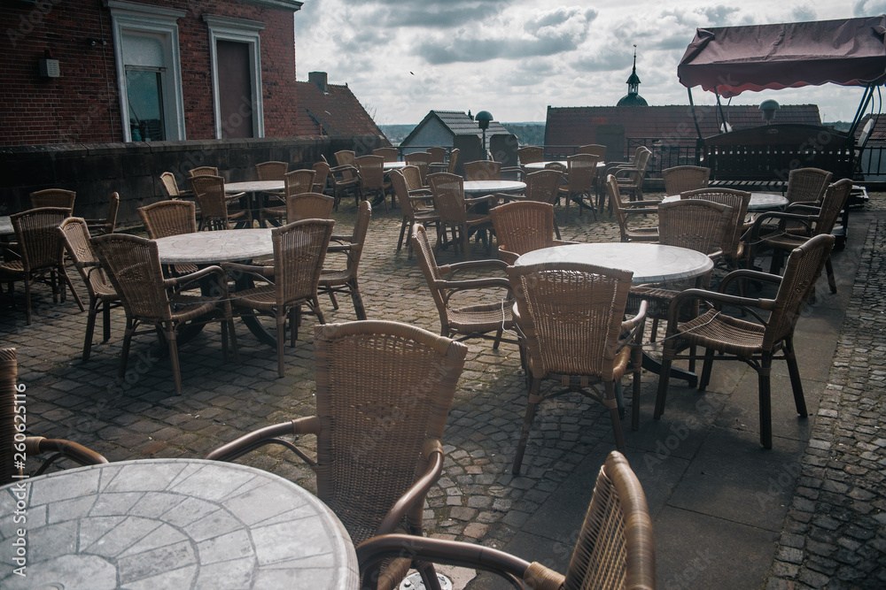 View of empty outdoor cafe in Bad Bentheim, Germany, with cozy decorations