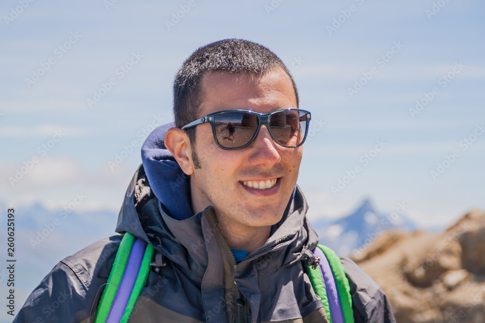 Man Traveler on mountain summit enjoying aerial view hands raised over clouds Travel Lifestyle success concept adventure active vacations outdoor happiness freedom emotions