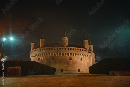Kraków Barbican. Ancient historical fortress in Poland. Gate to the city, night dusk shot