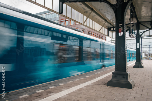 Blurred train motion with high speed at railway station