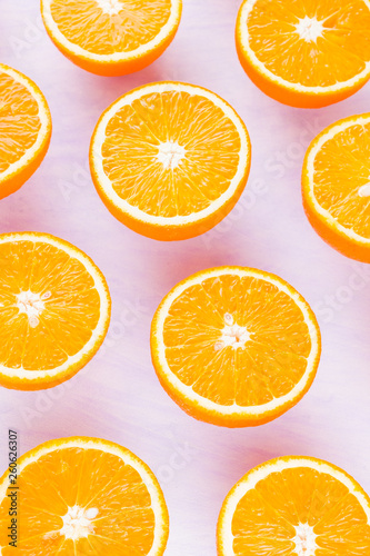 Background of oranges fruits. Many halves of fresh oranges, top view. Citrus for making juice. A lot of sliced oranges on white background. Concept