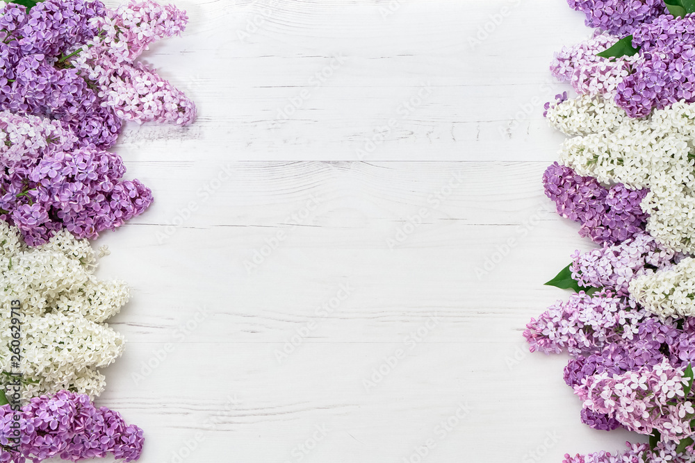 Floral pattern of lilac branches, flowers background. Flat lay, top view. Floral pattern of lilac branches, flowers background. Flat lay, top view.